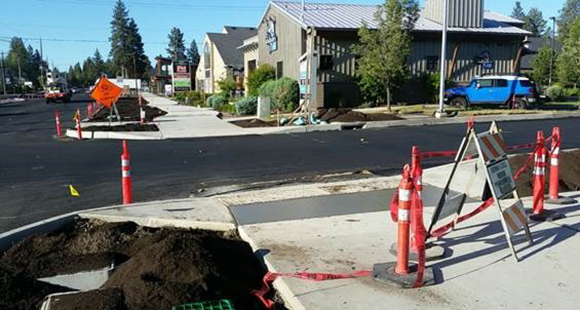 Newly completed sidewalks and freshly paved portions of 14th Street.