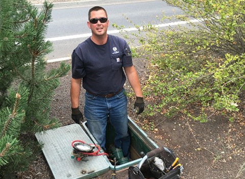 City Utility worker testing backflow assembly.