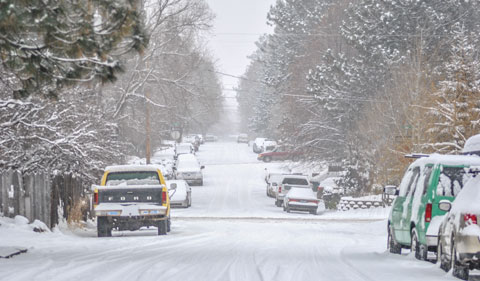 A snowy street in Bend.