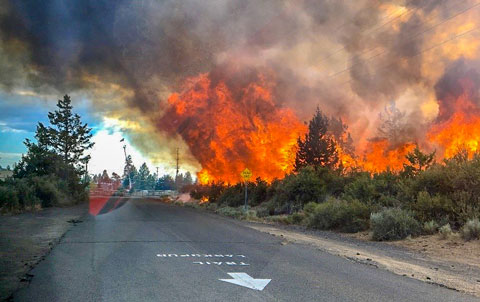 Large flames and smoke from the 2018 Pilot Butte wildfire, which was started by illegal fireworks.