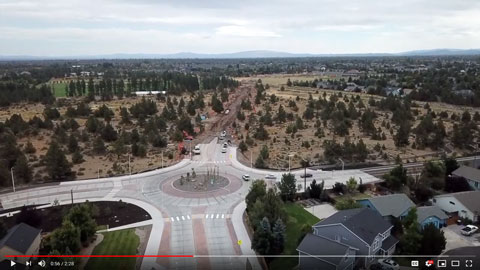 Still frame from YouTube video about Empire Corridor Improvements Project showing aerial view of newly completed roundabout.