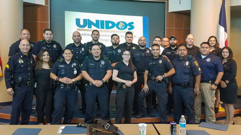 Group of police officers at Unidos event.