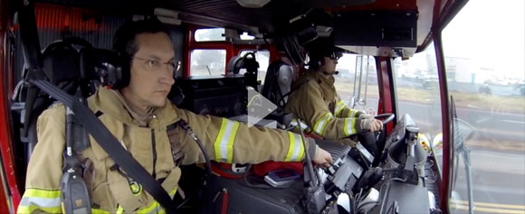 Firefighters in a fire engine.