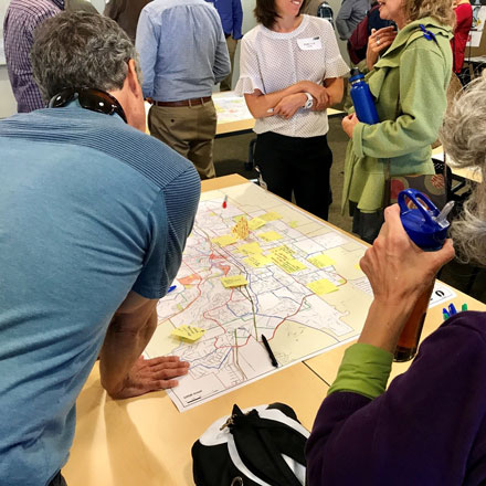 Community members looking at map of Bend.