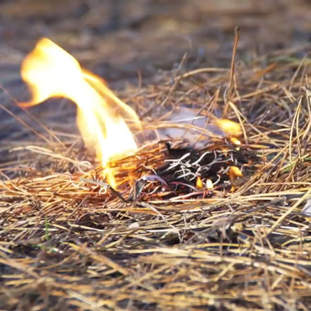 Still frame from Before You Buy Illegal Fireworks video of brush fire starting.