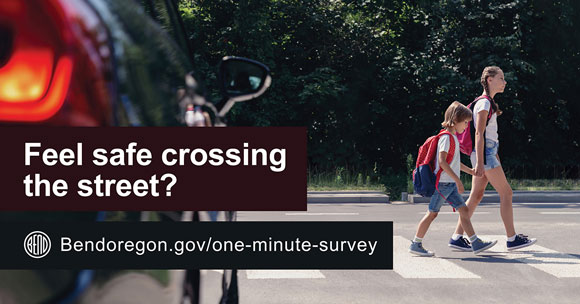 Children crossing the street at a crosswalk on the way to school with text reading feel safe crossing the street? bendoregon.gov/one-minute-survey