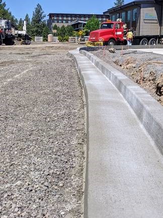 A photo of the new curb and gutter forming the perimeter of the roundabout.