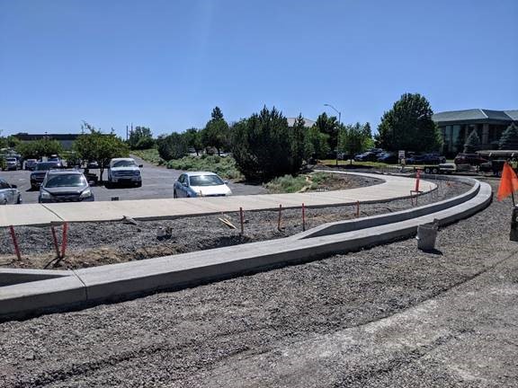 A photo of the new curb and gutter forming the perimeter of the roundabout.