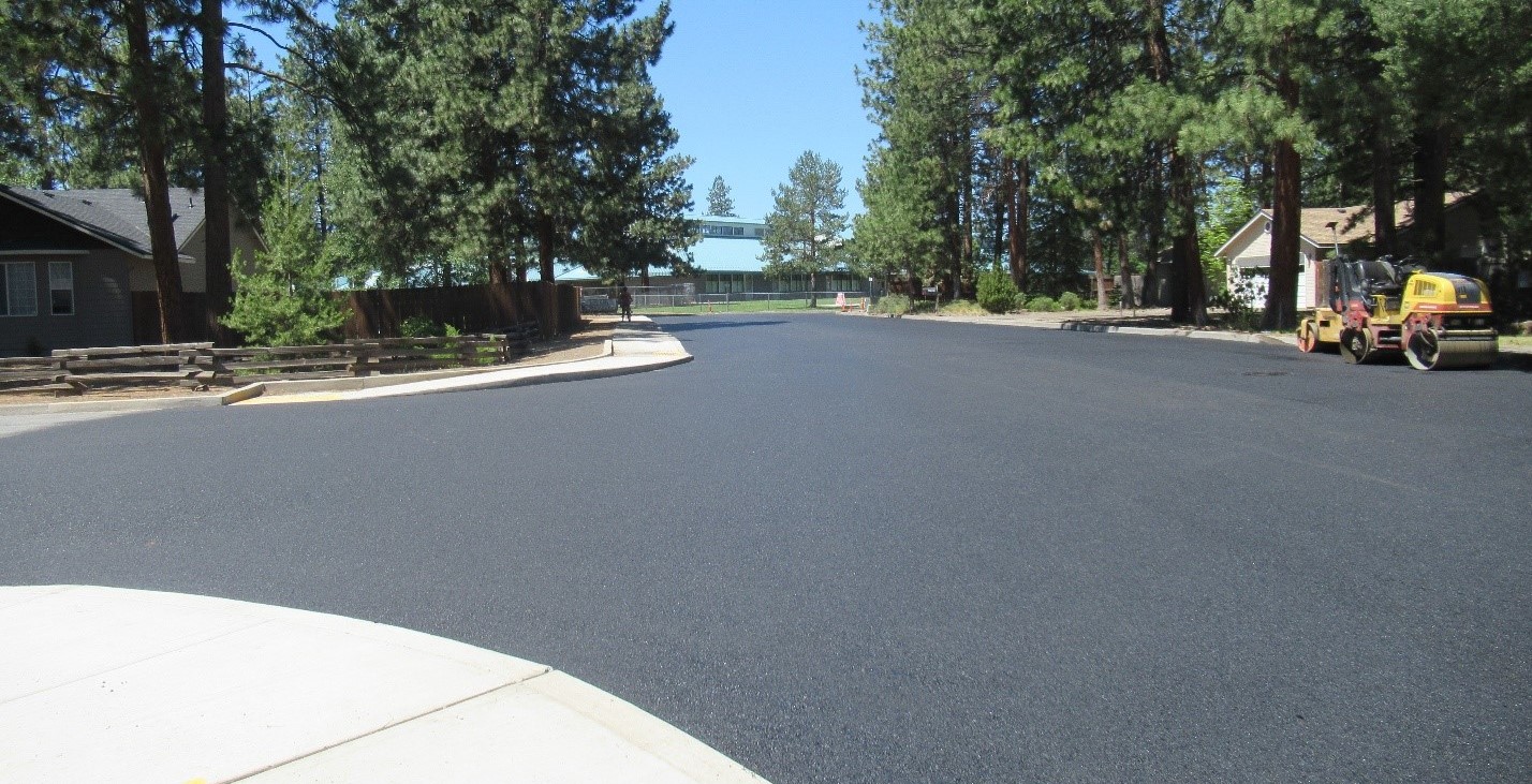 completed project area showing the newly paved road in sw sewer improvement neighborhood