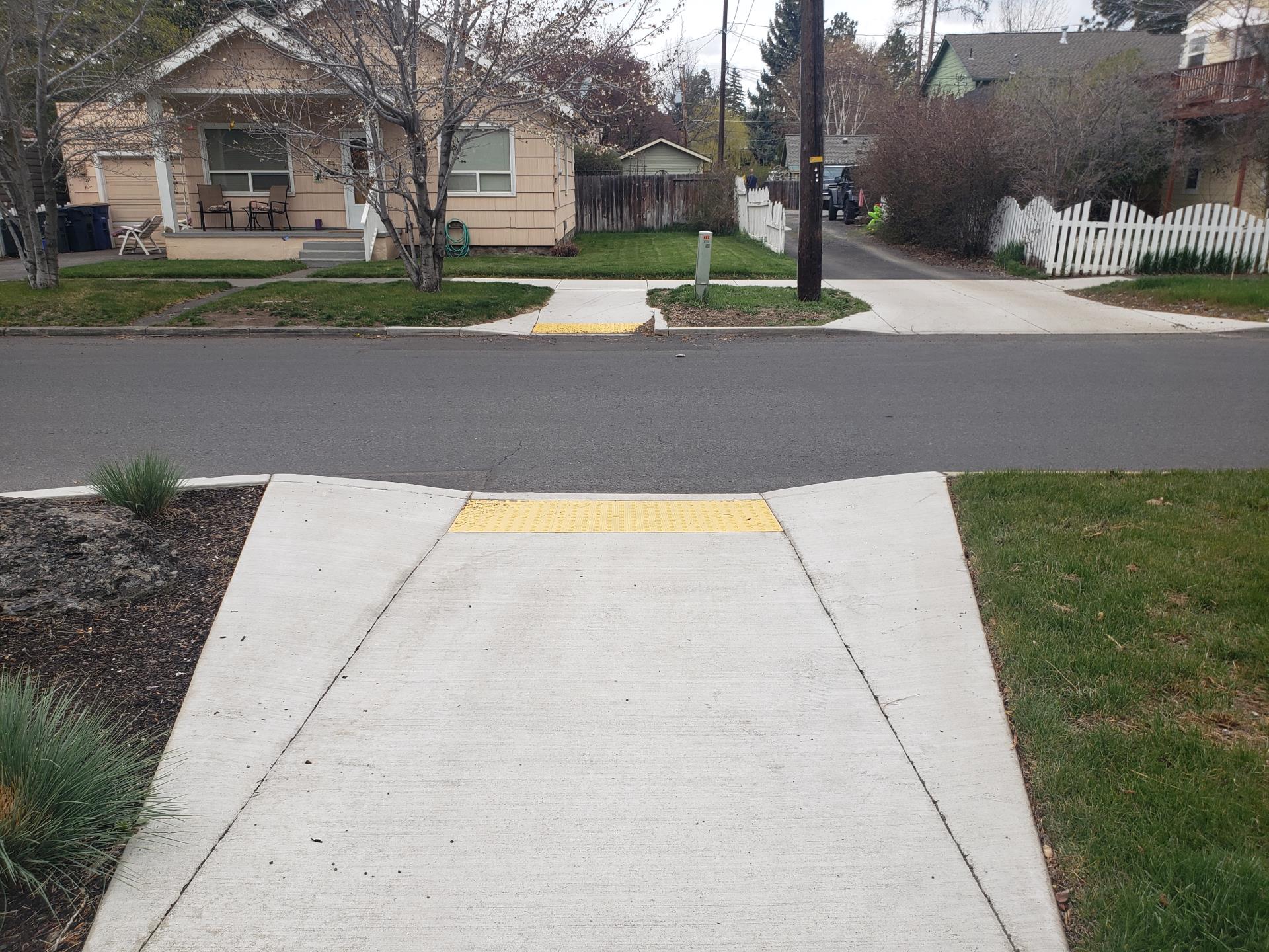 Riverside and Hood – intersection with new curb ramps and reconstructed alley driveway.