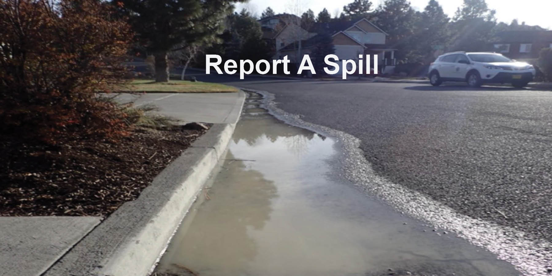 Report A Spill roadway with spill