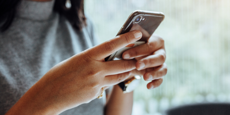 Woman using parking app on mobile.