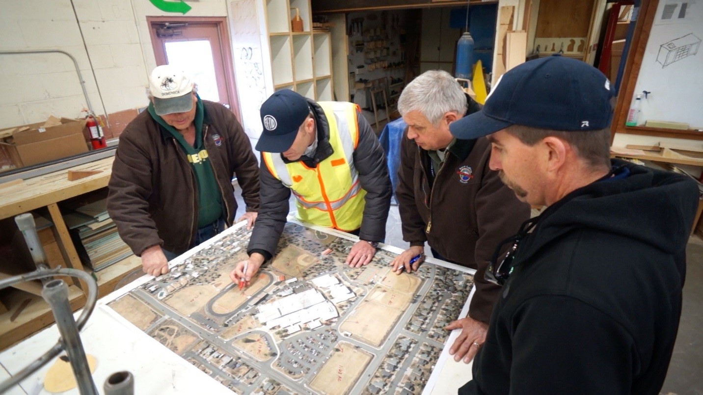 Landscape contractors and WaterWise conservation staff reviewing landscape plan