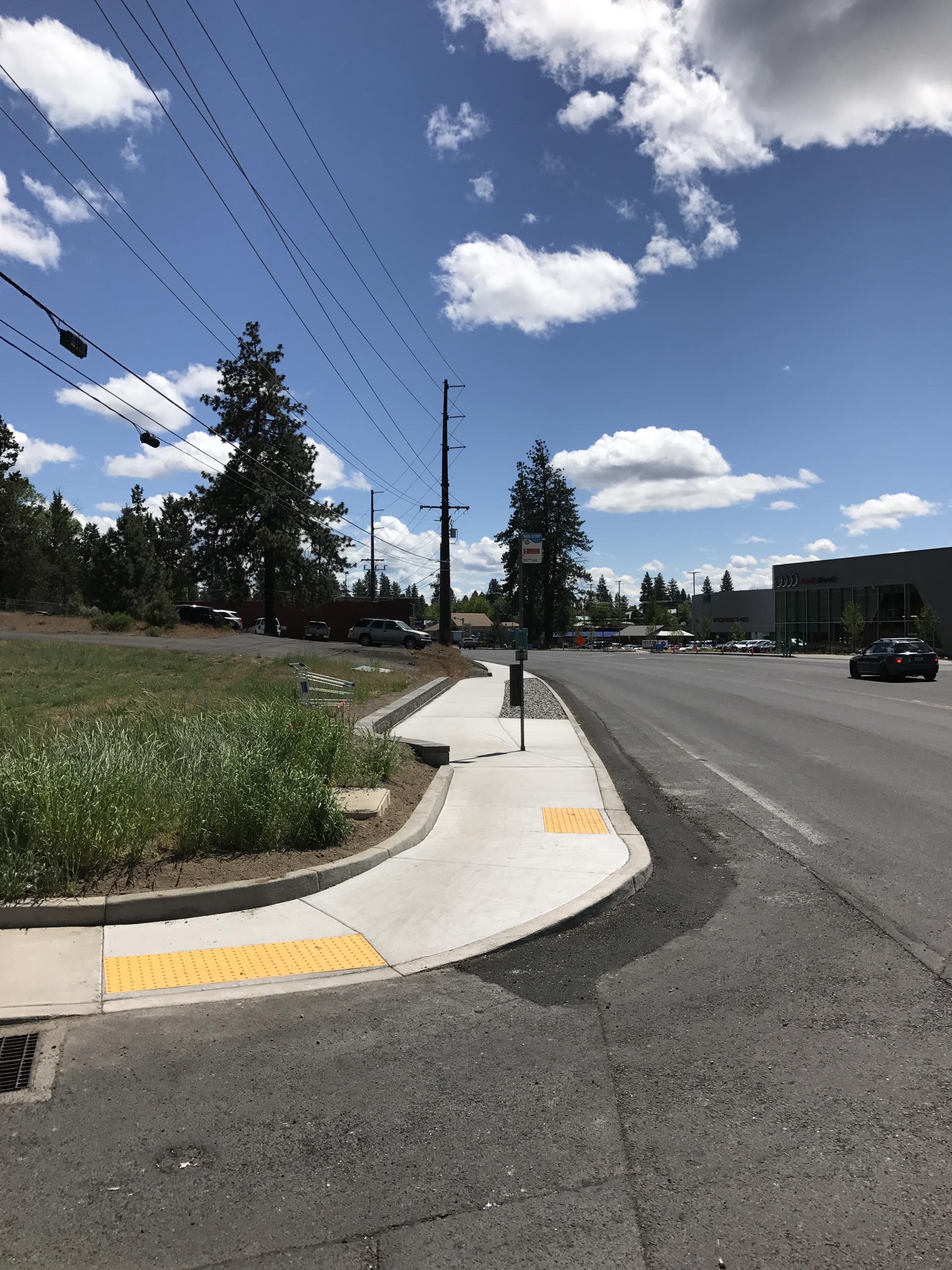 Completed sidewalk corner showing ADA ramps