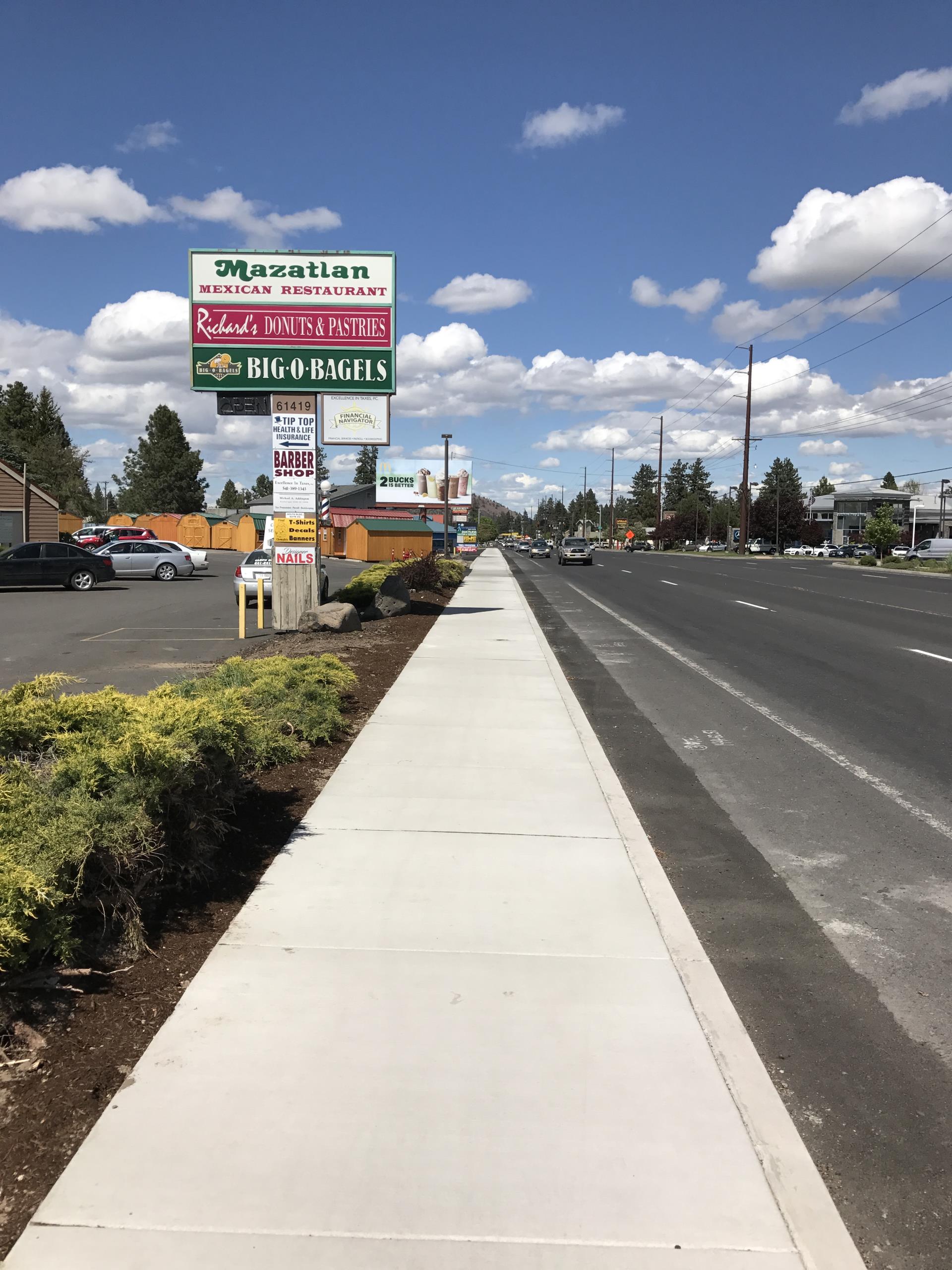 Long stretch of completed sidewalk along 3rd Street