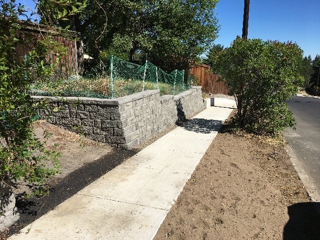 Shepard Rd 1 After Photo - Reconstructed sidewalk in same area as Shepard Rd 1 Photo, new retaining wall and trimmed vegetation.