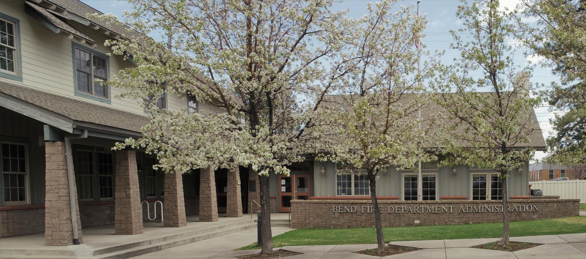 Fire Administration Building in spring with trees in bloom