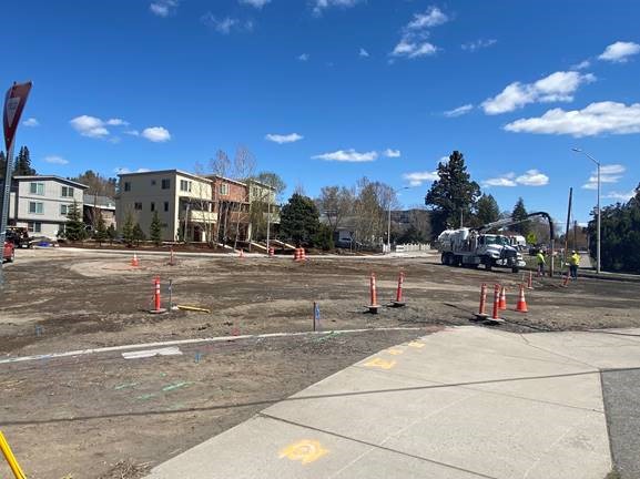 A photo capturing asphalt removal at the 9th St./Newport Ave. roundabout.