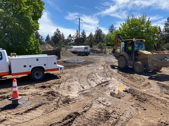 Work crews and equipment working on construction near Nasu Park Loop and Butler Market Road.