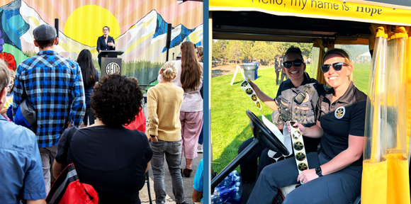 People watching Mayor Melanie make a speech on the left side of the photo and two women from the Bend Police Department sitting in a yellow golf cart smiling on the right side.