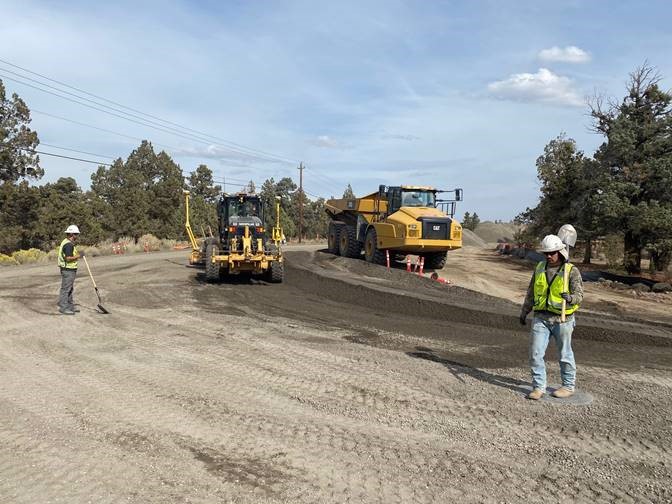 A photo of work crews and equipment working on the Pioneer Loop Restoration.
