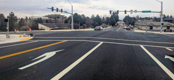 A photo of the fresh asphalt on the intersection of Neff road in Bend Oregon.