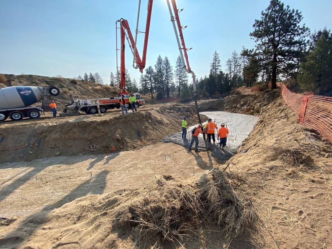 Work crews pour concrete for the construction of the Murphy bridge.