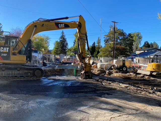 A photo of work crews and excavating equipment working on upgrading the pump station.