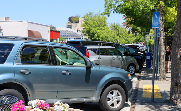 Cars parked along the road in downtown Bend.