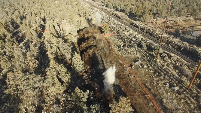 An aerial photo overlooking the launch shaft blasting work next to the BNSF railroad