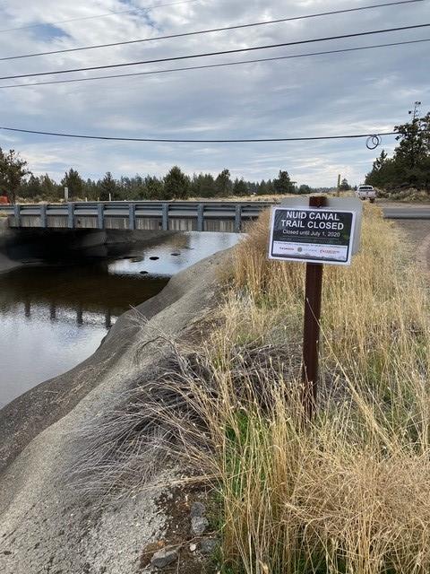 Picture showing sign indicating the trail adjacent to the North Unit Irrigation at Purcell Boulevard closed.