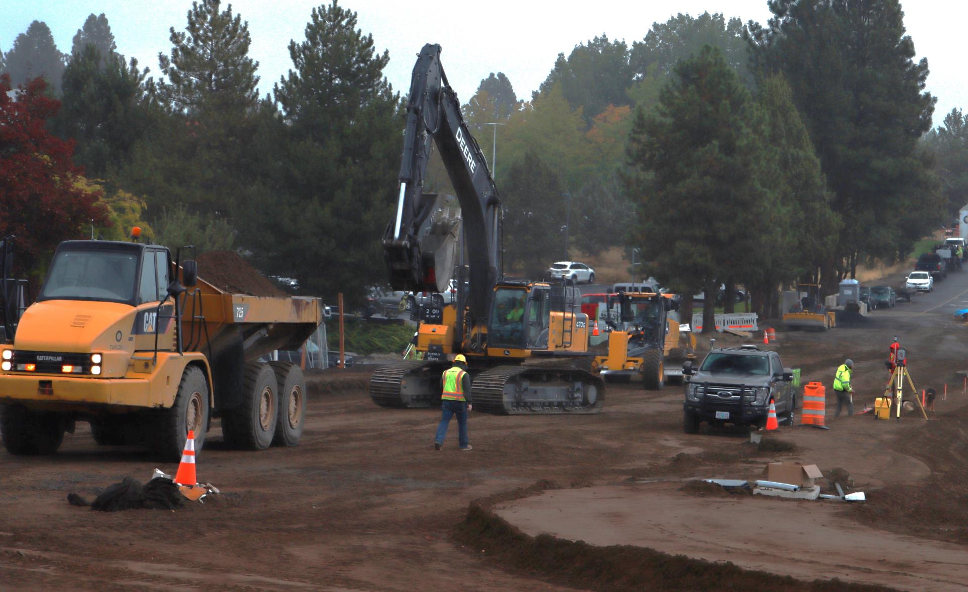 crews continue raising the roadway elevation of Neff Road