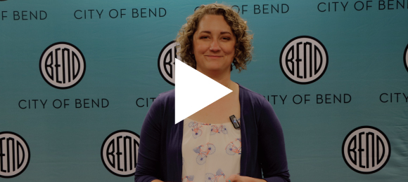 The Mayor standing in front of a City of Bend backdrop