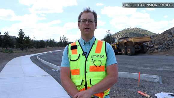 A City of Bend engineer talking in front of Purcell in Bend, OR.