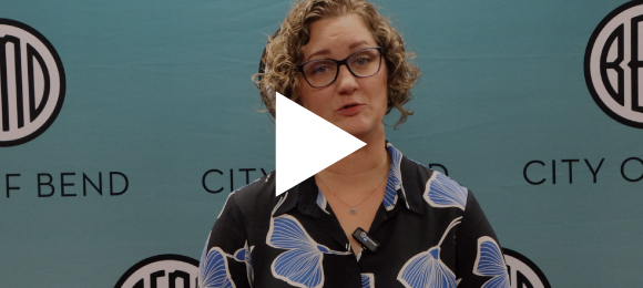 The Mayor standing in front of a City of Bend backdrop