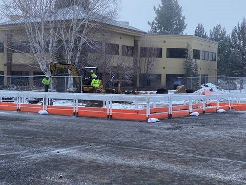 A photo of work crews, equipment, and barricades on the corner of the Colorado Avenue & Columbia Street intersection.