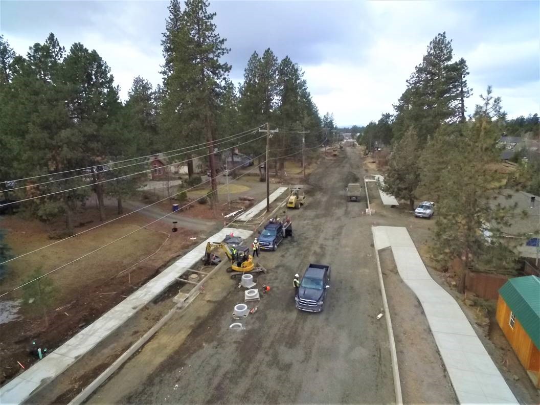 A photo looking west over work crews and equipment at the Murphy Road extension project site.