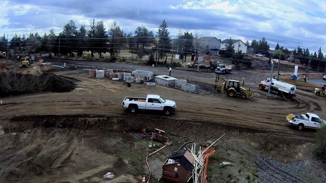 A photo of work crews, trucks, and equipment at the 27th Street & Butler Market Road roundabout construction site.