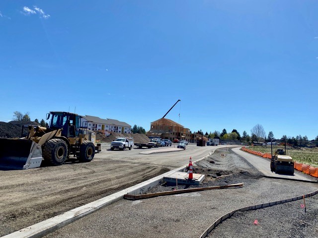 A photo of the Empire extension sidewalks being poured and the walking trail being paved.