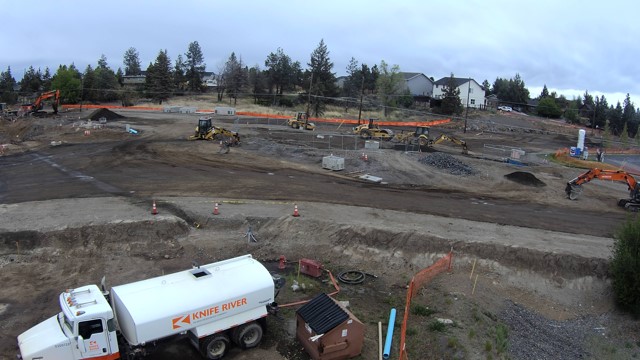 A photo of work crews and equipment working at the Butler Market Road and 27th Street roundabout construction site.