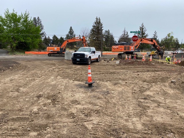 A photo of work crews, excavation equipment, and cones and markers at the Butler Market Road and Nasu Park Loop construction site.