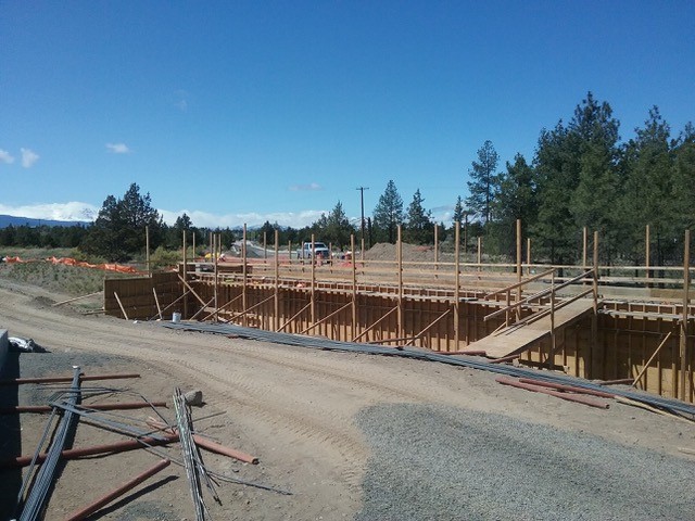 A photo of the Empire pedestrian undercrossing construction with construction materials laid out on the ground.