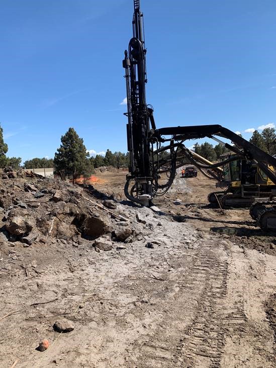 A photo of work crews using large equipment to drill for the North Pointe Lateral at Juniper Ridge.