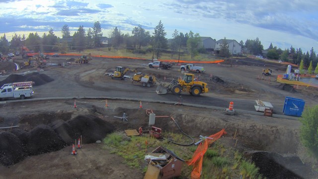 A photo of work crews and equipment at the 27th and Butler Market Road roundabout construction site.