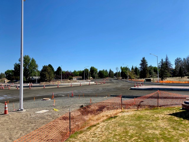 A photo of the 27th Street construction area with cones and a street light post on the right side of the photo.