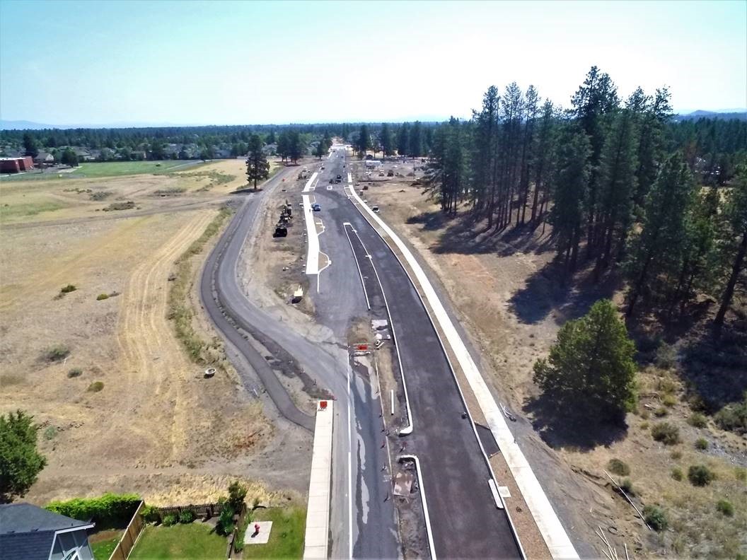 An aerial bird's-eye view looking over Murphy Road looking east, with a majority of the concrete sidewalk and medians constructed.