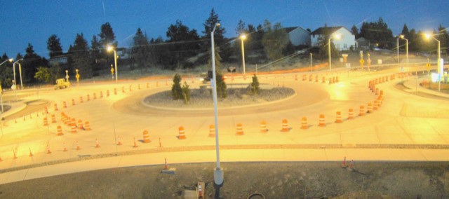 A photo of the 27th Street & Butler Market Road roundabout, taken at night with the street lights lighting the roundabout.