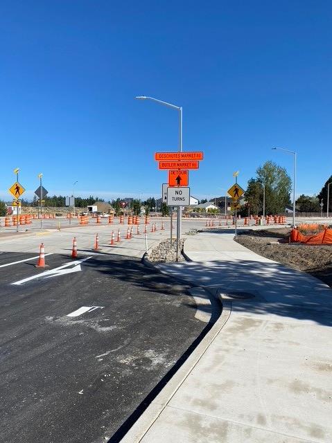 A photo of the Deschutes Market Road & Butler Market Road, with cones and road signs to control traffic.
