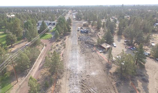 An aerial photo of work crews drilling for blasting west of Pioneer Loop.