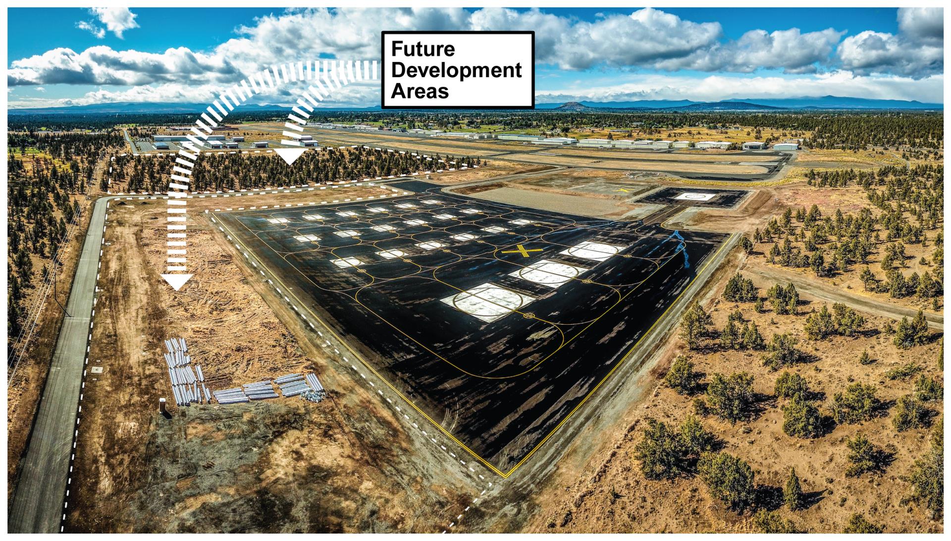Aerial photo showing future development areas near the helipads at the Bend Municipal Airport.